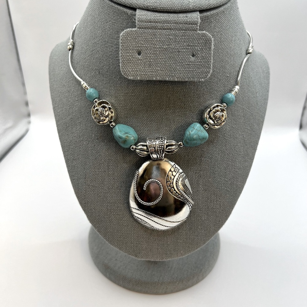 Tibetan Silver pendant with turquoise accents